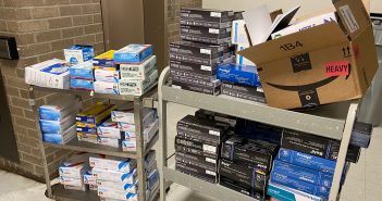 Boxes of medical supplies on two utility carts