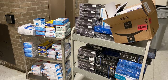 Boxes of medical supplies on two utility carts