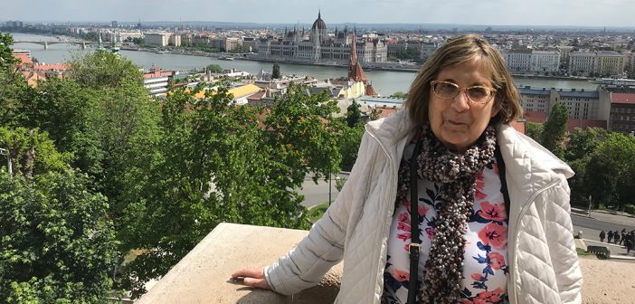 Carolyn Pagani in Budapest, with the Danube in the background.