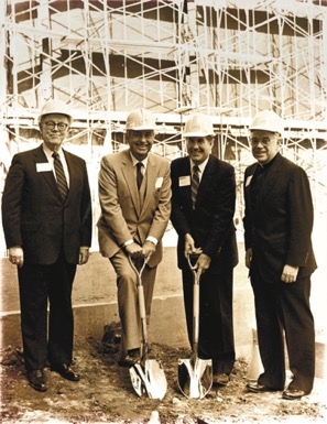 John Feerick poses with a shovel at hte Fordham Law groundbreaking