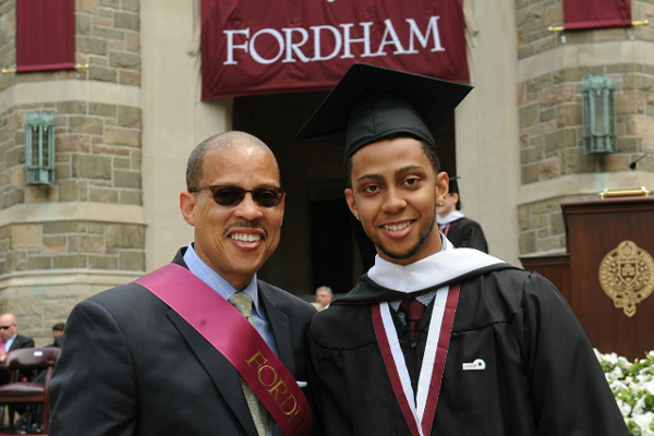 Dayne Carter at his graduation in 2015, with father Anthony Carter, FCRH ’76.