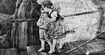 Detail of a black-and-white photo of an image of two children crossing a rickety bridge
