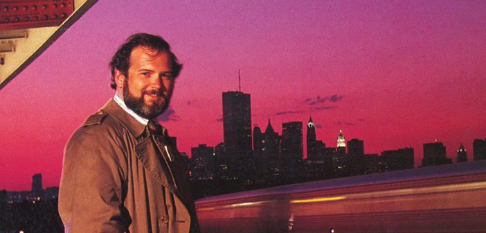 A man stands in front of the New York skyline in 1991
