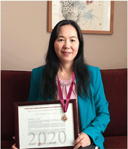Chun Zhang, professor of education, received the Bene Merenti medal for 20 years of service.