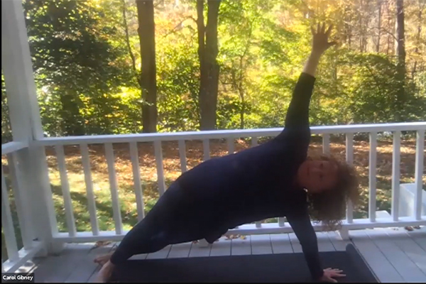 Carol Gibney leading a yoga class.