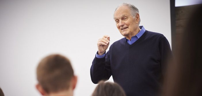 Alan Alda speaking in front of a class