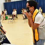 Student with yellow stole at AAPI graduation celebration