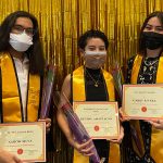 Students with yellow stoles and diplomas at AAPI graduation