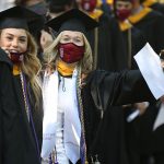 student in line-up with caps and gowns