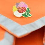 Orange stole with fower pin