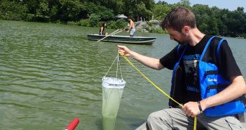 Michael Kautsch sampling water from the Central Park Lake