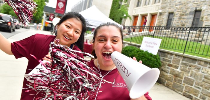 Move-in voluntters with megaphone and pom poms