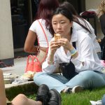 girl holds hot dog