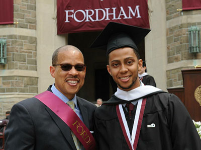 Anthony Carter (left) with his son Dayne at the 2015 Fordham College at Rose Hill diploma ceremony. Photo by Chris Taggart