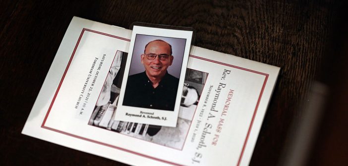 A prayer card and memorial Mass program featuring a photo of the late Fordham professor and dean Raymond A. Schroth, S.J.