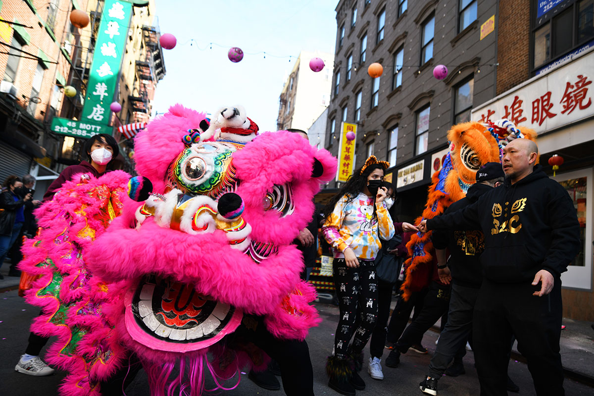 Lion dancers strut down Mott Street in Manhattan's Chinatown neighborhood during Lunar New Year celebrations on February 12, 2022.