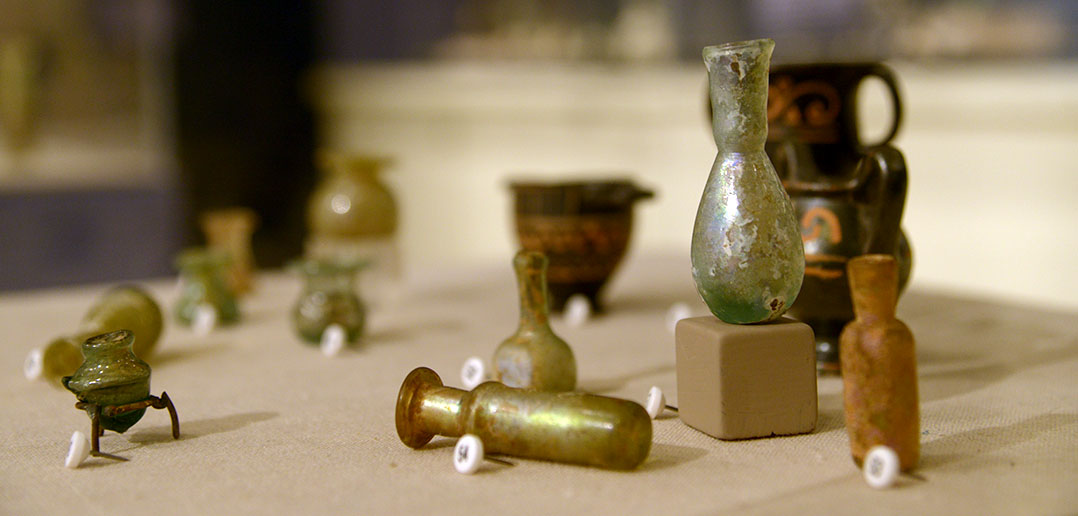 Small Roman bottles in a museum case