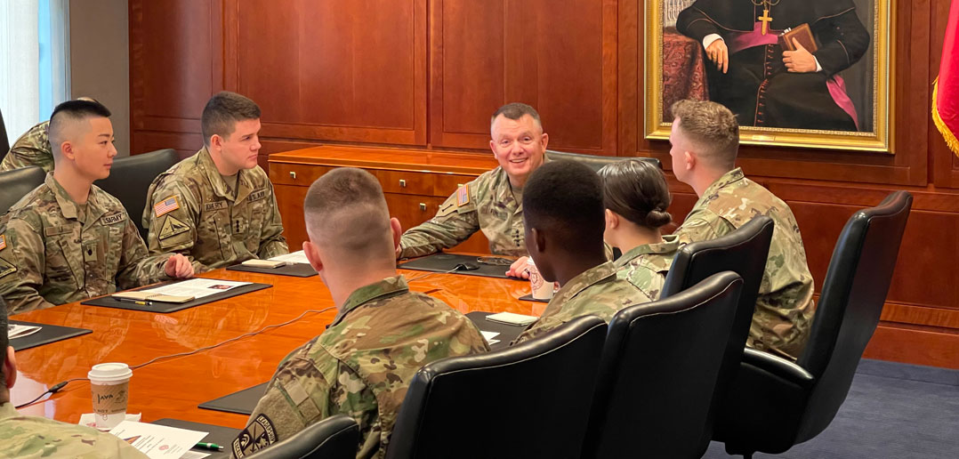A military general meets with members of Fordham ROTC.
