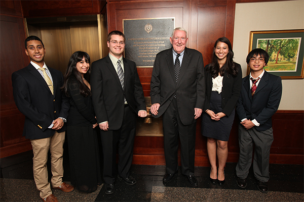 E. Gerald Corrigan, third from right, poses with recipients of the E. Gerald Corrigan, Ph.D., Endowed Scholarship Fund.