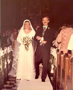 Georgine and Leo Hoar walking down the aisle of the University Church after they were married.