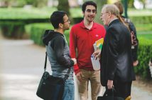 Three men talk at Fordham