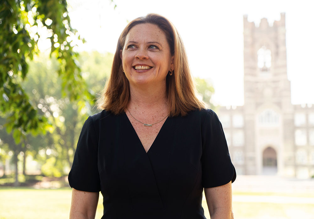 Fordham University President Tania Tetlow at Fordham's Rose Hill campus with Keating Hall in the background