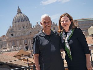 Fordham University President Tania Tetlow with Arturo Sosa, S.J., superior general of the Society of Jesus, in front of St. Peter's Basilica