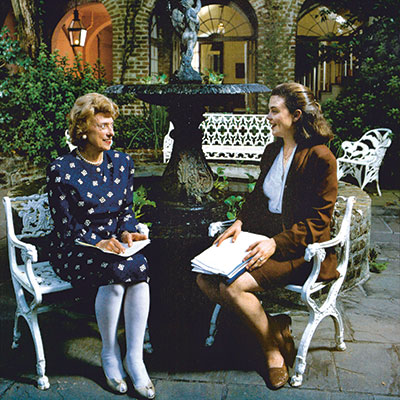 Tania Tetlow (right) with her mentor Lindy Boggs in the courtyard of Boggs' Bourbon Street home in New Orleans. Photo by Jerry Ward. Used with permission of Tulane University.
