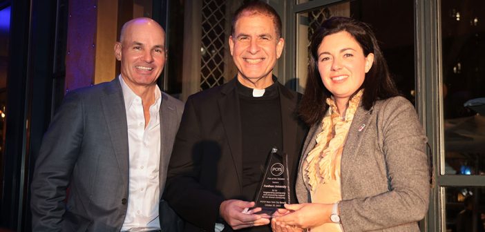 John Cecero, S.J. (center), vice president for mission integration and ministry, accepted an award from POTS’ executive director Christina Hanson (right) and Keith Pagnani, chair of the nonprofit’s board of directors.