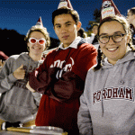 Students at Football game in birthday hats
