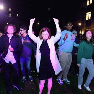 President Tetlow dances with students around her