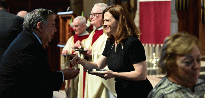 President Tetlow giving holy communion