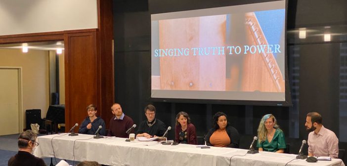 A panel of people in front of a screen that says Singing Truth to Power