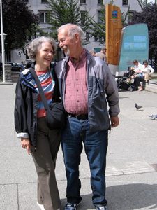 an older couple standing outside
