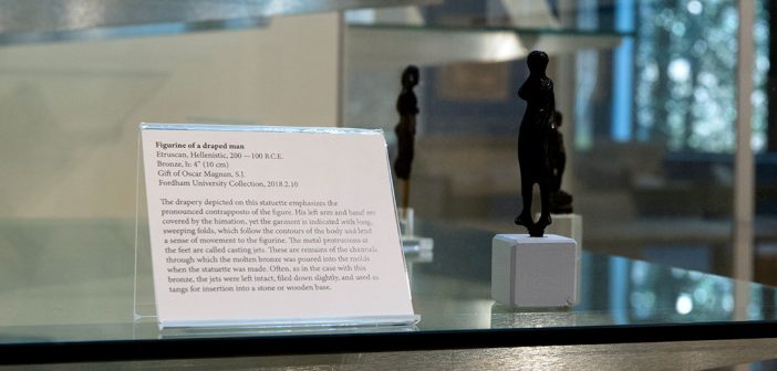 a small black figurine on display
