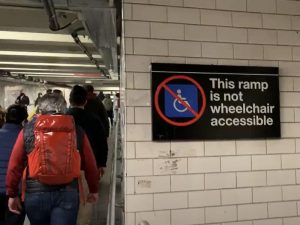 A sign that says "This ramp is not wheelchair accessible"