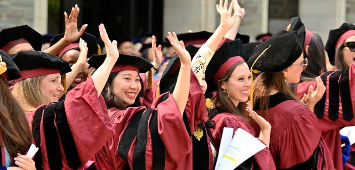 GSE graduates waving to guests