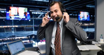 A man broadcasting hockey