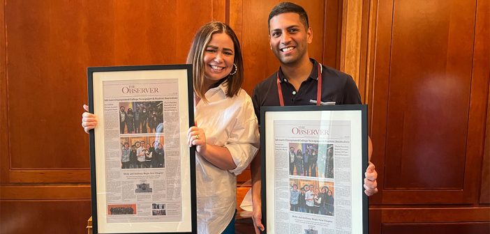 Molly Bedford and Anthony Hazell pose with mock Observer front pages with messages to them.
