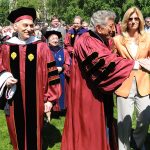 Tony Bennett shaking hands with a person while standing next to Larry Stemple an his wife, Susan Benedetto