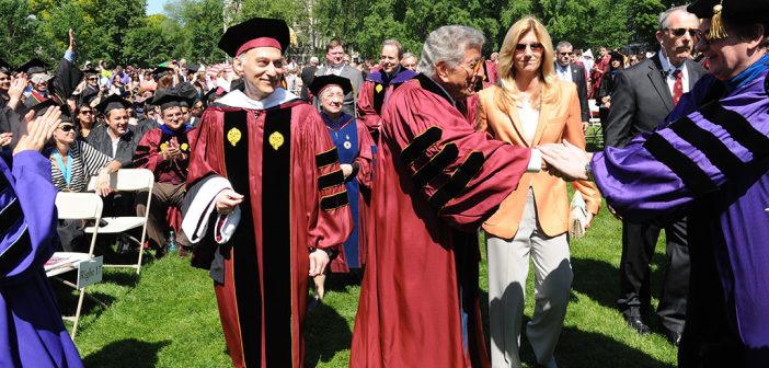 Tony Bennett shaking hands with a person while standing next to Larry Stemple an his wife, Susan Benedetto