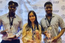 Latif Diaoune, Daphne Buitron, and Isaac Mullings stand and hold awards.