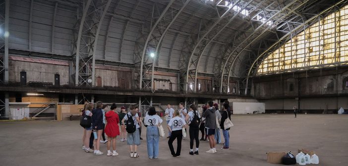 Students standing in the Kingsbridge Armory