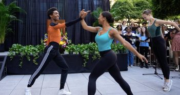 Two students dance together.