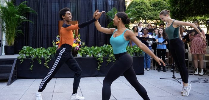 Two students dance together.