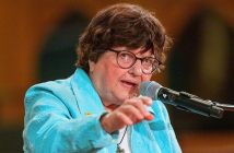 Sister Helen Prejean speaks at a microphone in front of the crowd at St. Paul the Apostle Church