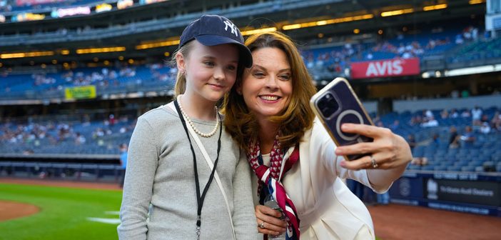 Tania Tetlow standing with her daughter at Yankee Stadium