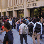 Large group of students, wide shot of club fair at Lincoln Center.