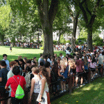 Mass of students on pathway near Edwards Parade.
