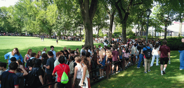 Mass of students on pathway near Edwards Parade.